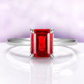 Raspberry Tourmaline Solitaire Engagement Ring in Sterling Silver with an emerald-cut red gemstone set in a minimalist polished band by Aquamarise, perfect for October birthstone jewelry.