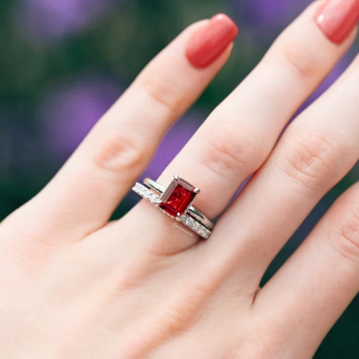 Raspberry Tourmaline Engagement Ring Set- Sterling Silver by Aquamarise, featuring an emerald-cut red tourmaline with a sparkling silver band and matching diamond-accented ring.