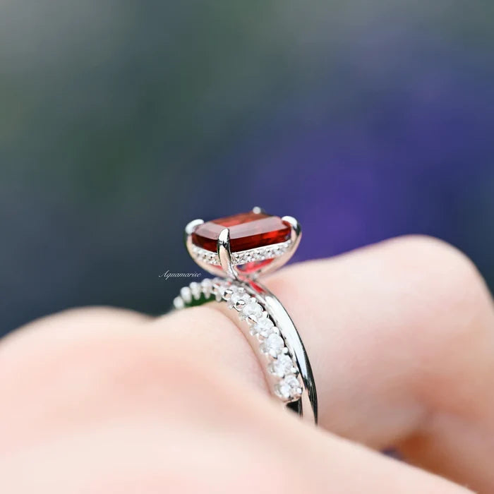 Raspberry Tourmaline Engagement Ring Set- Sterling Silver by Aquamarise, featuring a classic emerald-cut raspberry red tourmaline with sparkling diamond accents on a polished sterling silver band.