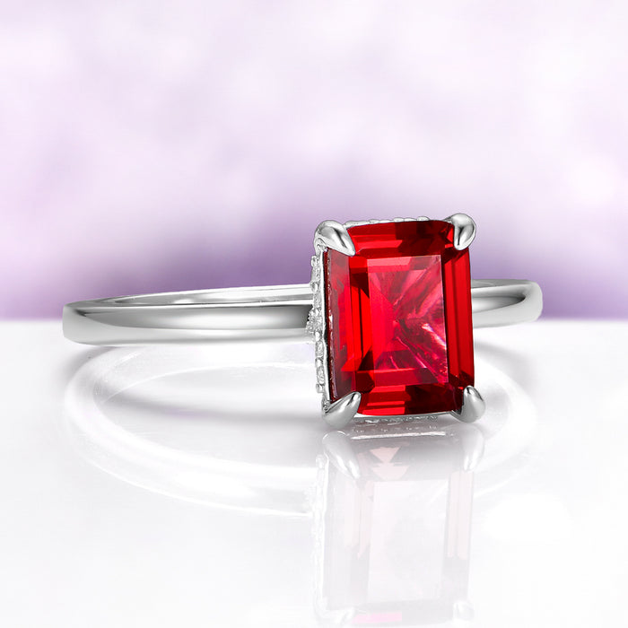 Raspberry Tourmaline Solitaire Engagement Ring in Sterling Silver by Aquamarise, featuring a radiant rectangular red gemstone set on a sleek polished band for elegant October birthstone jewelry.