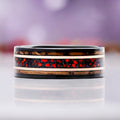 Red Fire Opal Whiskey Barrel Men's Wedding Band in Black & Rose Gold Tungsten (8mm) by Aquamarise, showing the red opal and wood inlay channels.