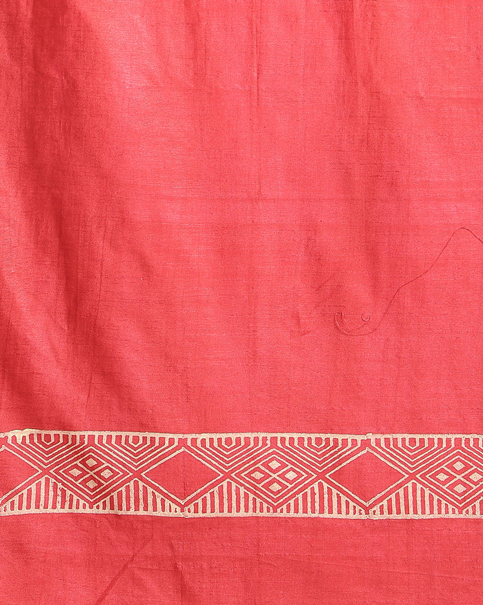 Bright red katan silk unstitched suit set hand block printed with small angular teal and off-white sprigs and geometric bands at the ends of the length.