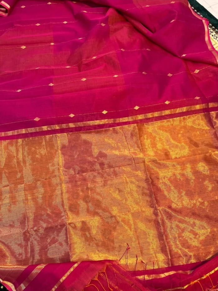 Magenta-red Maheshwari silk saree with small zari buta and a wide golden yellow zari border, handwoven in Maheshwar