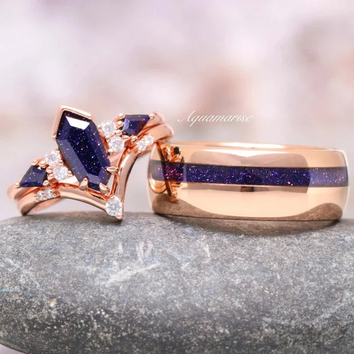 Galaxy Sandstone Starry Night Couples Ring Set featuring rose gold bands with deep blue sandstone and sparkling diamond accents by Aquamarise for matching his and hers rings.