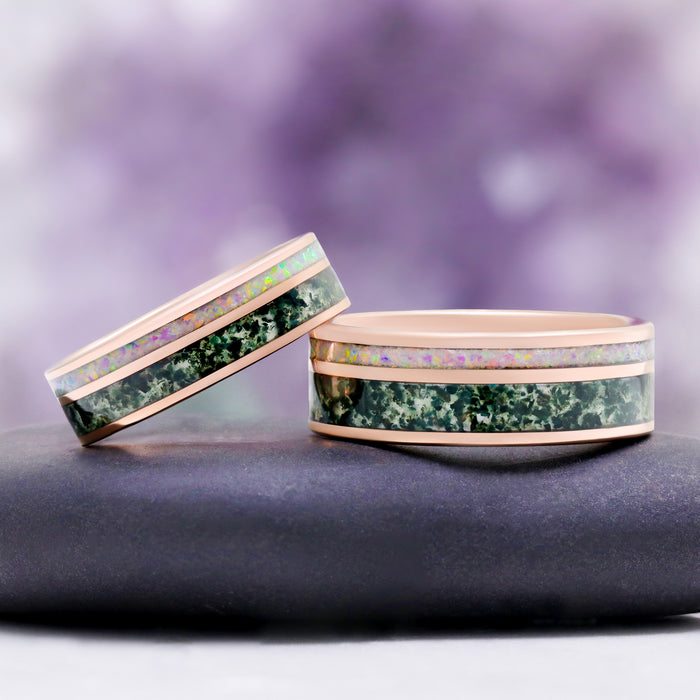 Rose Gold Tungsten Moss Agate & Fire Opal Couples Ring Set by Aquamarise, two rose gold bands inlaid with green moss agate and white fire opal.