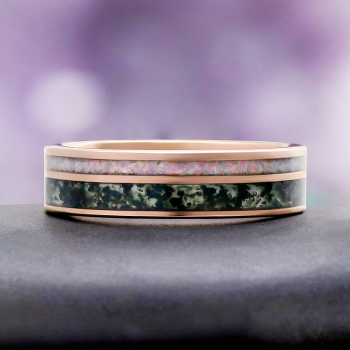 Moss Agate & Fire Opal Men's Ring in Rose Gold Tungsten by Aquamarise, resting on a grey stone pedestal.