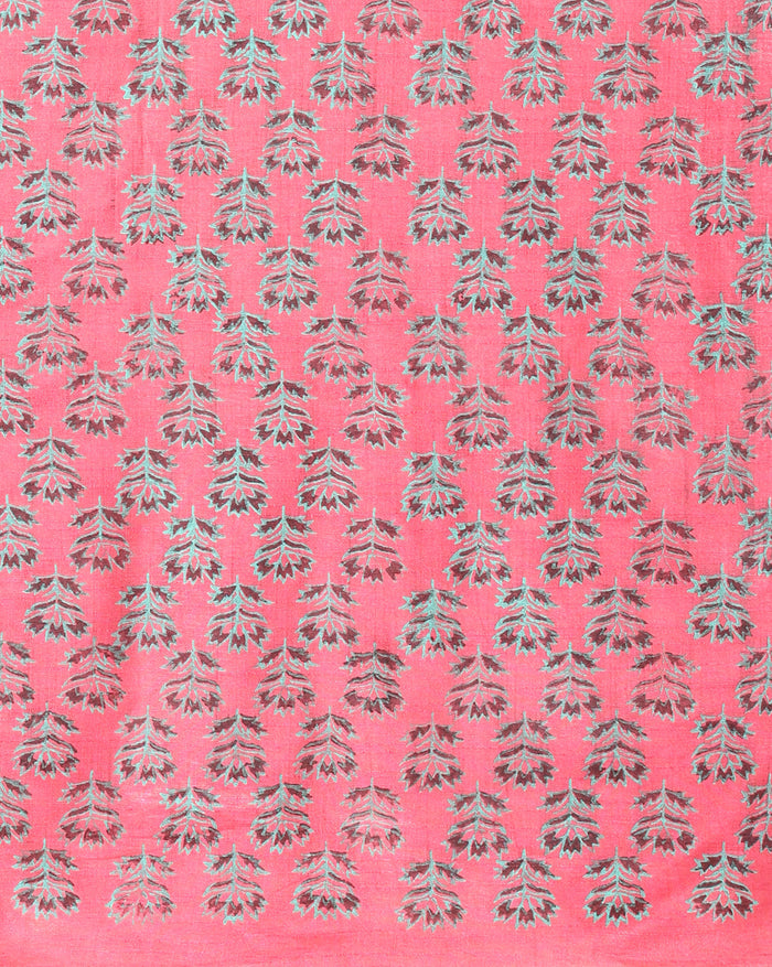 Vibrant pink katan silk unstitched suit set hand block printed with grey and white floral motifs, shown with a fringed dupatta carrying a decorative band.