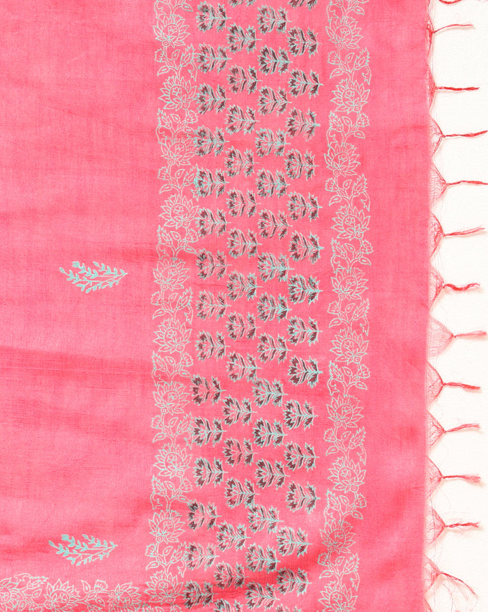 Vibrant pink katan silk unstitched suit set hand block printed with grey and white floral motifs, shown with a fringed dupatta carrying a decorative band.