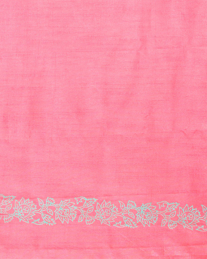 Vibrant pink katan silk unstitched suit set hand block printed with grey and white floral motifs, shown with a fringed dupatta carrying a decorative band.