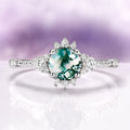 Round Green Moss Agate Ring in Sterling Silver by Aquamarise featuring a round natural green moss agate center with intricate leaf-inspired diamond accents on a polished band.