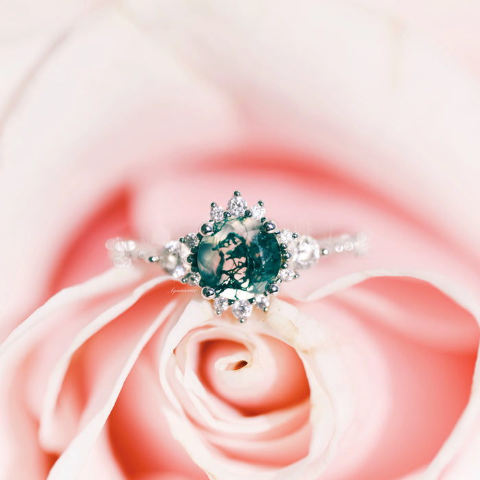 Round Green Moss Agate Ring in Sterling Silver by Aquamarise featuring a round green moss agate center with delicate diamond accents, styled on a soft pink rose petal background.