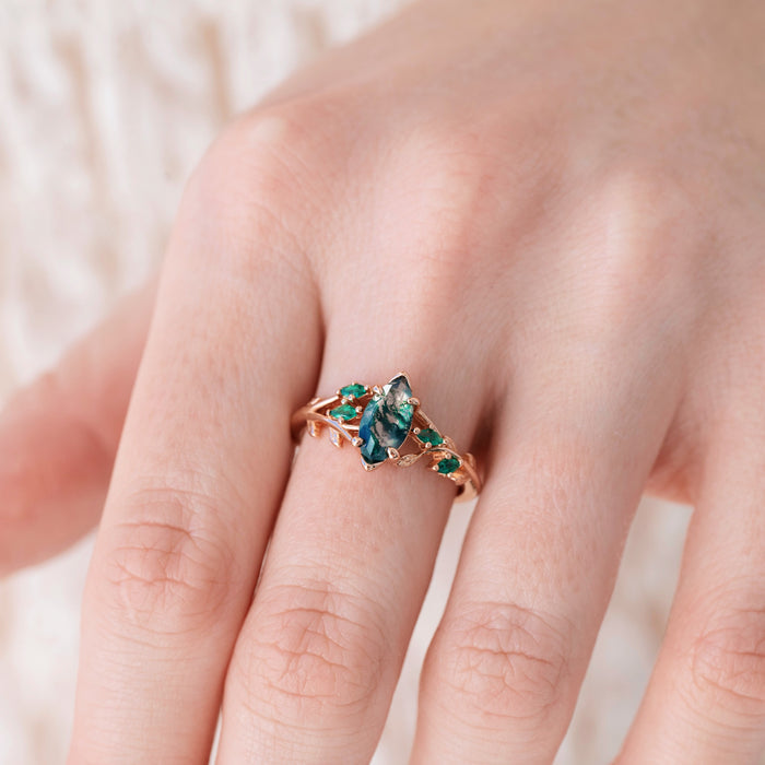 Rowan Marquise Moss Agate Leaf Engagement Ring in Solid 14K Rose Gold by Aquamarise Gold, featuring a marquise moss agate center stone with sculpted leaf accents and green gemstone details, part of Nature-Inspired Engagement Rings and Non-Traditional Gemstone Engagement Rings collections.