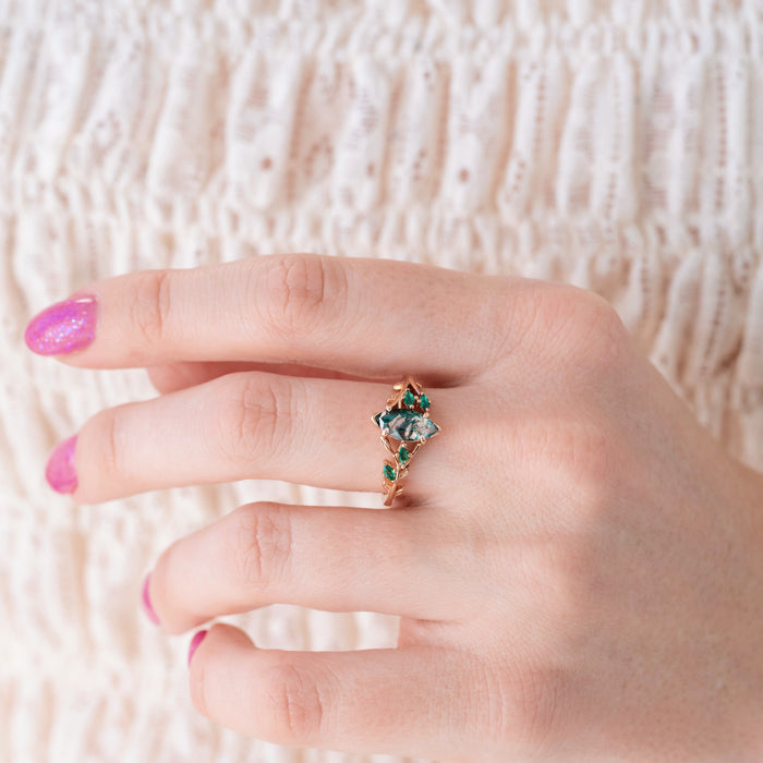 Rowan Marquise Moss Agate Leaf Engagement Ring in Solid 14K Rose Gold by Aquamarise Gold, featuring a marquise moss agate center with delicate green gemstone accents and intricate leaf details, part of nature-inspired and non-traditional engagement rings collections.
