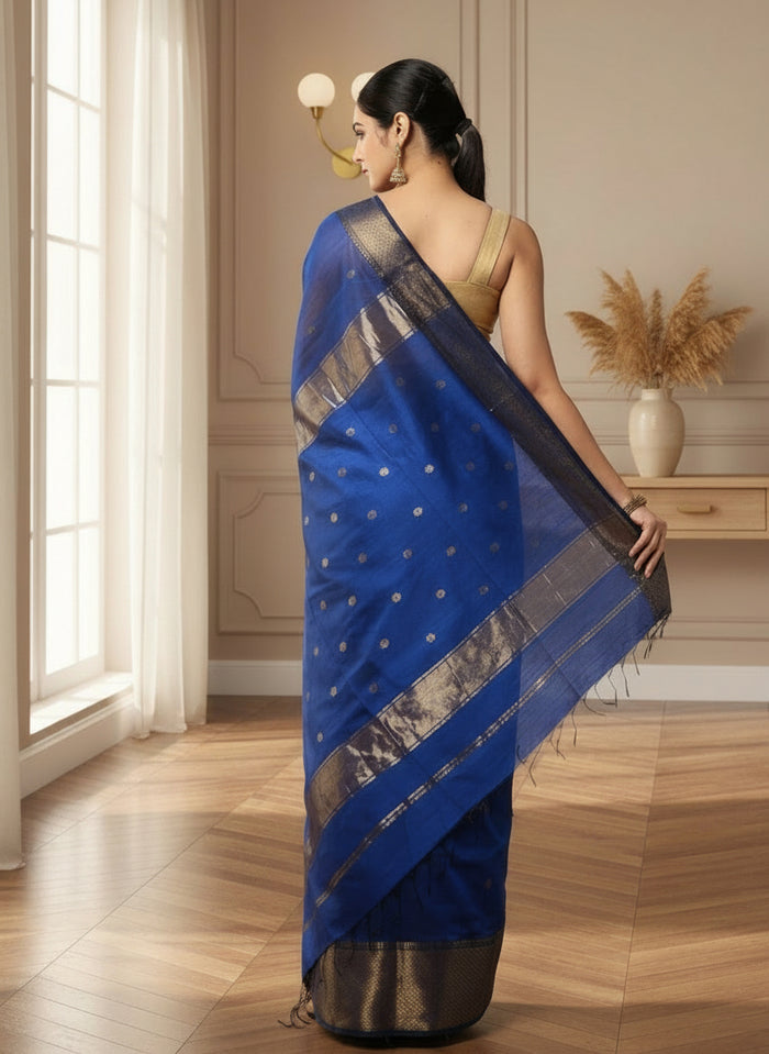 Royal blue Maheshwari silk saree with small gold buti across the body and a wide gold zari border, handwoven in Maheshwar