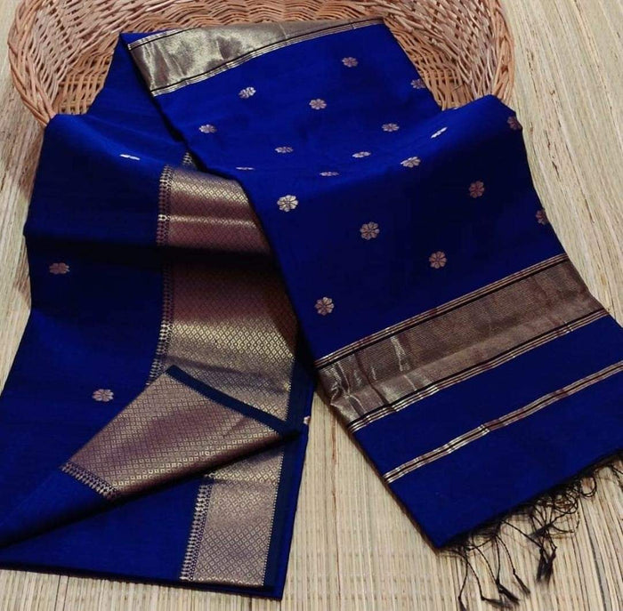 Royal blue Maheshwari silk saree with small gold buti across the body and a wide gold zari border, handwoven in Maheshwar
