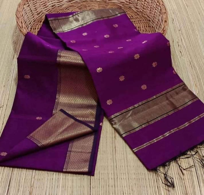Royal purple Maheshwari silk saree with small gold buti and a wide, densely patterned gold geometric border, handwoven in Maheshwar