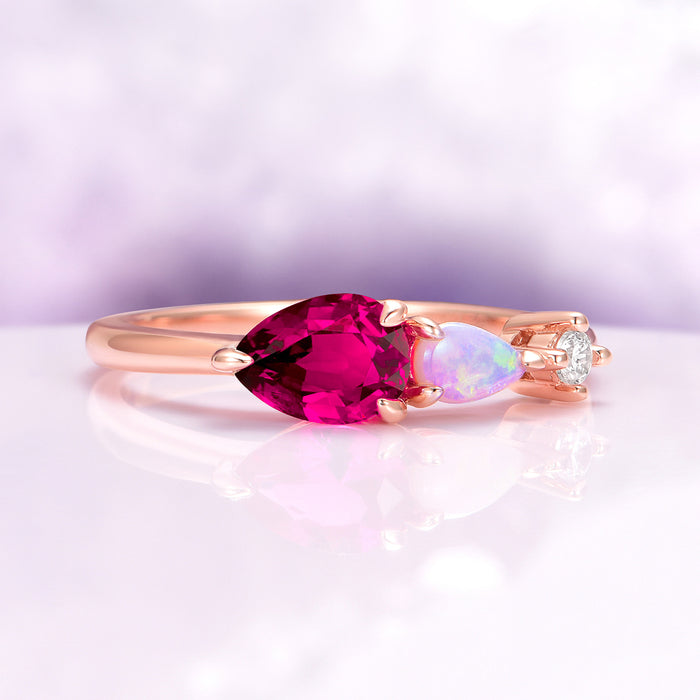 Lab Grown Ruby and Natural Australian Opal Engagement Ring in 14K Solid Rose Gold by Aquamarise Gold with pear-shaped ruby, Australian opal, and diamond accent on a sleek rose gold band.