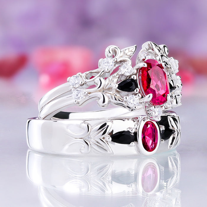 Angled view of the ruby and black onyx men's band beside the matching Carmilla bridal set, sold together as a couples set