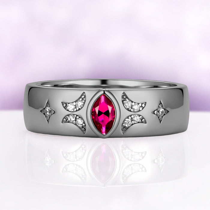 6mm black ruthenium wedding band with a bezel-set marquise lab-grown ruby flanked by pave crescent moons and four-point stars