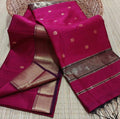 Handloom Maheshwari silk saree in ruby red, flower buti scattered across the body, with a wide golden zari border