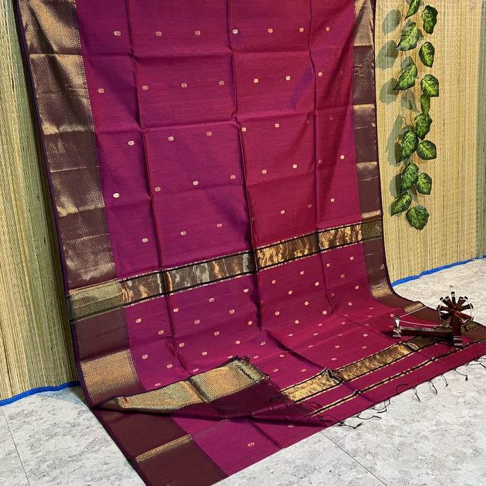 Handloom Maheshwari silk saree in ruby red, flower buti scattered across the body, with a wide golden zari border