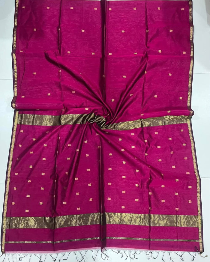 Ruby red Maheshwari silk saree with all-over buta body and parallel gold zari bands along the borders, handwoven in Maheshwar