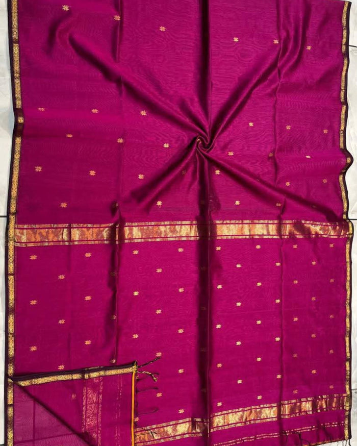 Ruby red Maheshwari silk saree with all-over buta body and parallel gold zari bands along the borders, handwoven in Maheshwar