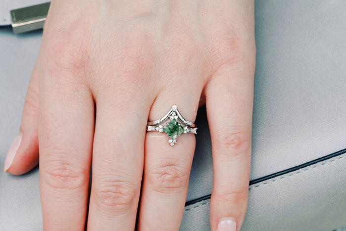 Princess Cut Moss Agate Engagement Ring Set in 14K White Gold by Aquamarise Gold, featuring a green moss agate center with diamond accents on a hand against a neutral background.