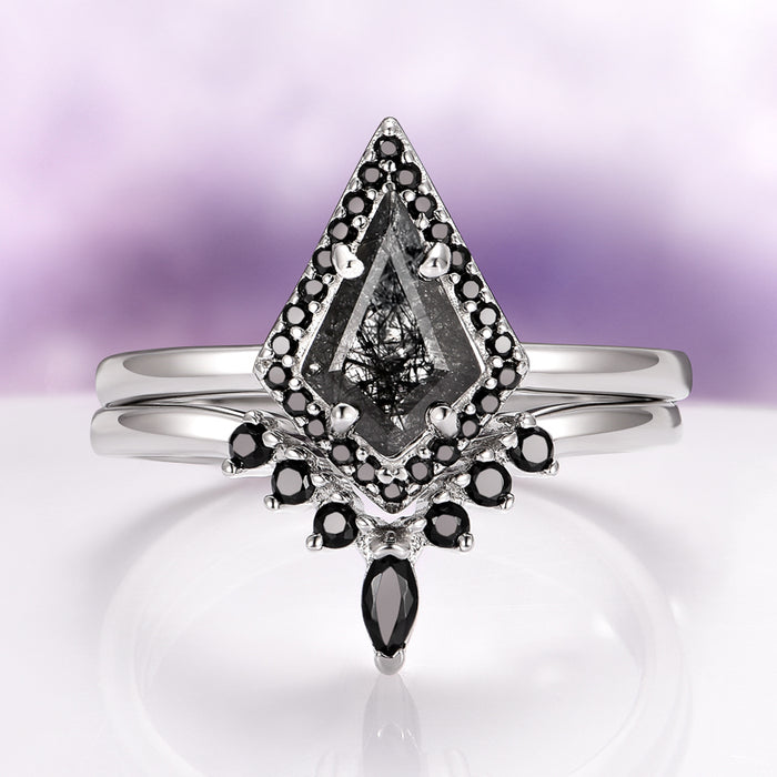 Rutilated Quartz & Black Onyx Engagement Ring Set in 14K White Gold by Aquamarise Gold featuring a kite-cut rutilated quartz center with black onyx accents on polished white gold bands.