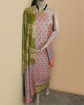 Salmon pink and olive green katan silk unstitched suit set hand block printed with small floral butas and wide geometric panels on the dupatta and bottom hem.