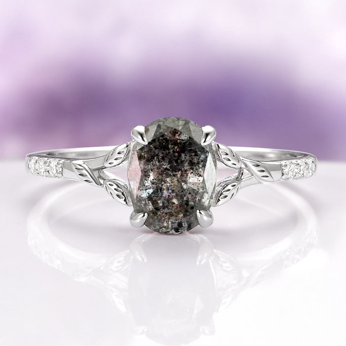 Oval Cut Natural Herkimer Diamond Engagement Ring in 14K White Gold by Aquamarise Gold featuring a unique oval Herkimer diamond with natural inclusions set in a delicate band accented with leaf-inspired detailing and small white stones, part of nature-inspired and alternative engagement ring collections.