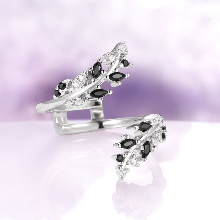 Black Moissanite Leaf Ring Guard in 14K White Gold by Aquamarise Gold featuring delicate leaf-shaped settings accented with marquise and round black moissanite stones, part of Solid Gold Engagement Rings and Lovers of the Dark™ collections.