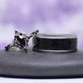 Shadow Queen Black Onyx Couples Ring Set by Aquamarise featuring black onyx gemstone with a silver filigree design and matching sleek black inlay band for his and hers promise rings.