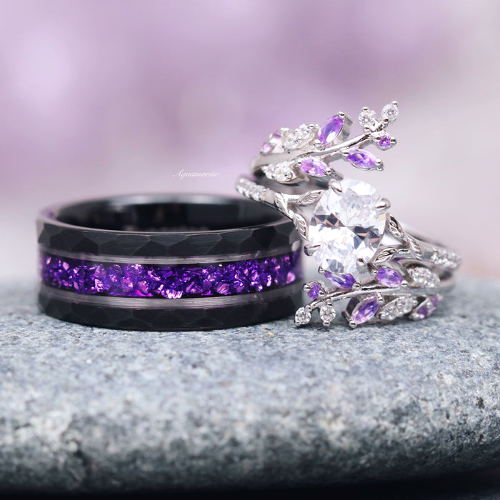 Crushed Amethyst Wedding Band- 8MM Black Tungsten featuring a hammered black tungsten band with vibrant purple crushed amethyst inlay, displayed alongside a silver ring with amethyst and clear stones, styled by Aquamarise from their Men's Wedding Bands and February Birthstone collections.