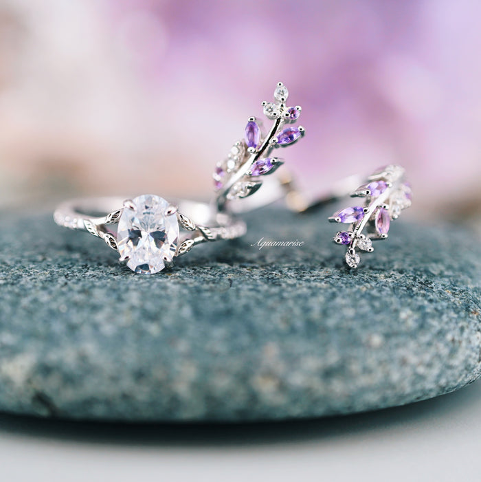 Simulated Diamond & Amethyst Leaf Couples Ring Set featuring delicate branches adorned with oval simulated diamond and purple amethyst leaves, crafted by Aquamarise as matching couples rings in nature-inspired elegance.