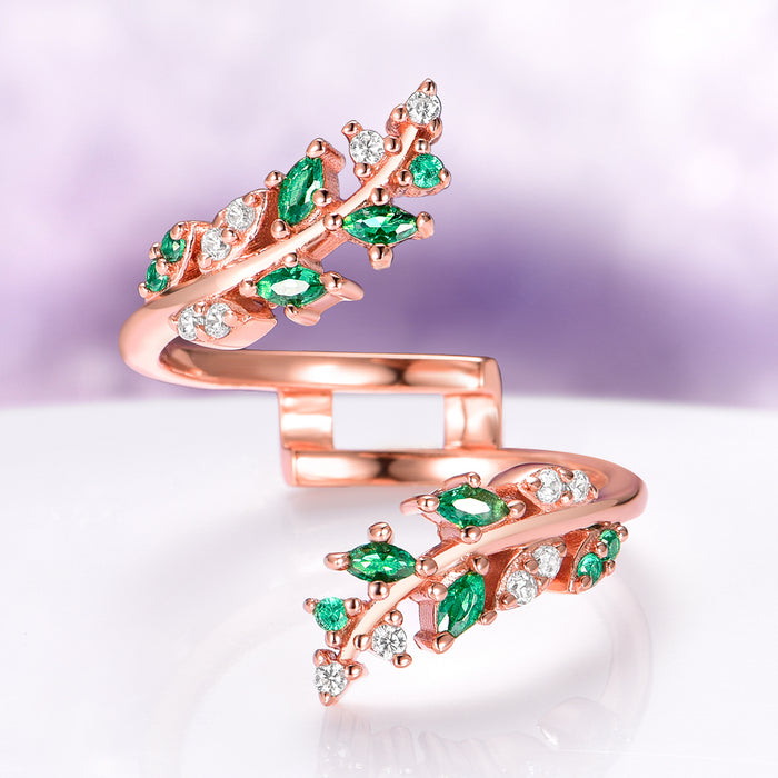 Lab-Grown Diamond & Emerald Leaf Engagement Ring Set in 14K Solid Rose Gold (IGI Certified) by Aquamarise Gold, featuring a delicate rose gold band adorned with marquise-cut emeralds and sparkling lab-grown diamonds in an intricate leaf design, part of nature-inspired and birthstone jewelry collections.