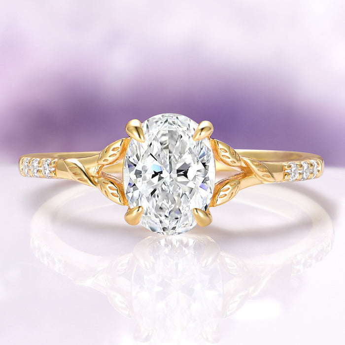 Lab-Grown Diamond Leaf Engagement Ring in 14K Solid Yellow Gold (IGI Certified) by Aquamarise Gold, featuring an oval-cut diamond centerpiece with nature-inspired leaf details and diamond accents on the band.