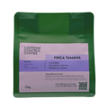 Green coffee package with purple label featuring 'Caffeine Control Coffee' branding