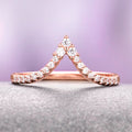Skye Kite® Chevron Stacking Wedding Band in 14K Solid Rose Gold by Aquamarise Gold displays a delicate V-shaped design accented with shimmering petite moissanite stones, part of Solid Gold Women's Wedding Bands and Rose Gold Rings collections.