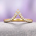 Skye Kite® Chevron Stacking Wedding Band in 14K Solid Yellow Gold by Aquamarise Gold features a delicate V-shaped design adorned with petite moissanite stones, part of Women’s Wedding Bands and Solid Gold Rings collections.