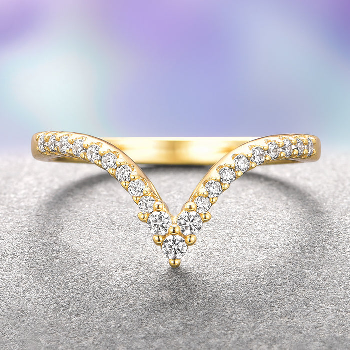 Skye Kite® Chevron Stacking Wedding Band in 14K Solid Yellow Gold by Aquamarise Gold features a delicate V-shaped design adorned with petite moissanite stones, part of Women’s Wedding Bands and Solid Gold Jewelry collections.