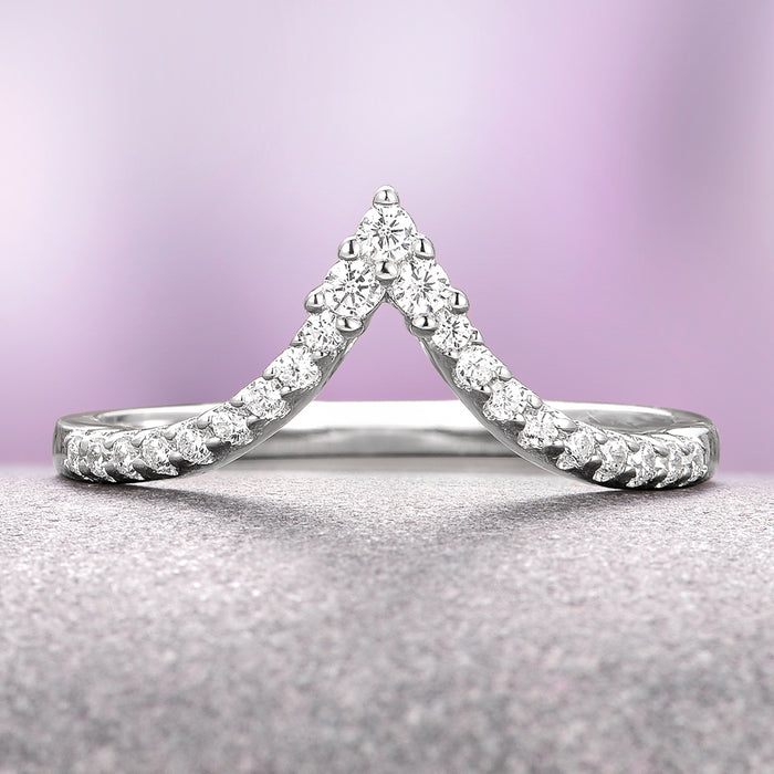 Skye Kite® Chevron Stacking Wedding Band in 14K White Gold by Aquamarise Gold features a delicate V-shaped design adorned with petite moissanite stones, part of the Women’s Wedding Bands and Solid Gold Rings collections.