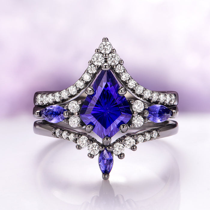 Skye Kite® Cornflower Sapphire Ring Set- Black Ruthenium showcases a striking deep blue kite-cut sapphire centerpiece accented by marquise and round white gemstones on a black ruthenium over sterling silver band by Aquamarise, part of the September Birthstone Jewelry and Fantasy-Inspired Engagement Rings collections.