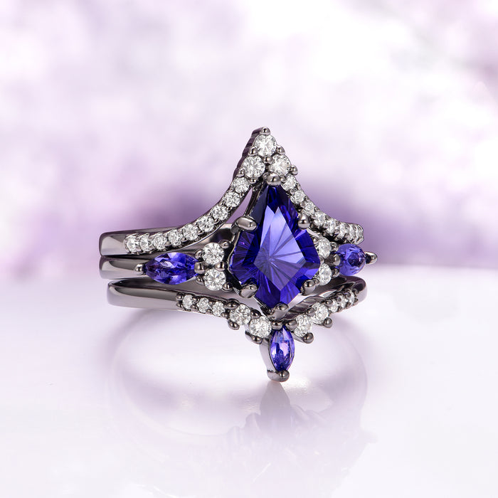 Skye Kite® Cornflower Sapphire Ring Set- Black Ruthenium featuring a kite-cut vibrant cornflower blue sapphire centerpiece accented with pear and round white gemstones on a black ruthenium over sterling silver band by Aquamarise, part of September Birthstone Jewelry, Engagement Rings for Women, and Lovers of the Dark™ collections.