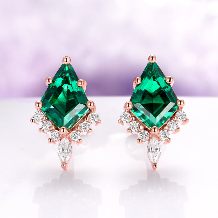 Skye Kite® Emerald Stud Earrings in 14K Rose Gold Vermeil by Aquamarise, featuring kite-cut emeralds accented with sparkling white stones in an elegant rose gold setting.