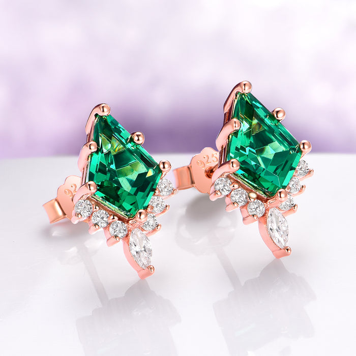Skye Kite® Emerald Stud Earrings in 14K Rose Gold Vermeil by Aquamarise, featuring kite-cut emeralds accented with sparkling white stones in a rose gold setting.