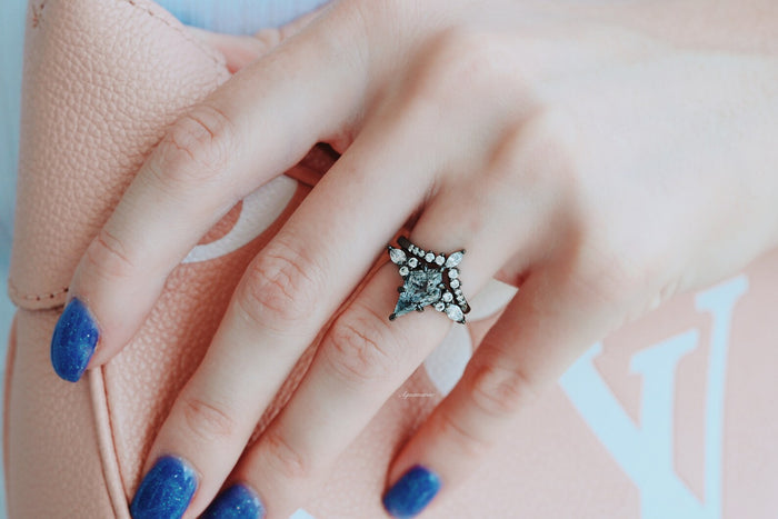 Skye Kite® Galaxy Herkimer Diamond & Meteorite Couples Ring Set shown on hand with sparkling blue nails holding a pale pink designer handbag by Aquamarise.