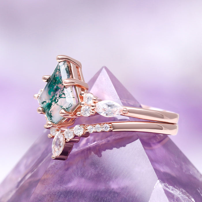 Skye Kite® Green Moss Agate Couples Ring Set featuring artisan rose gold bands with unique green moss agate and sparkling white gemstones by Aquamarise on a purple crystal.