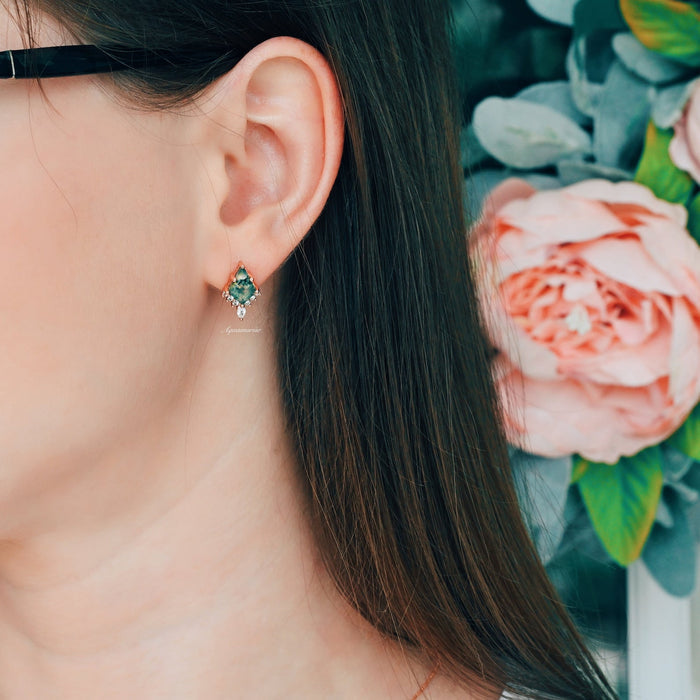 Skye Kite® Green Moss Agate Stud Earrings in 14K Yellow Gold Vermeil by Aquamarise, featuring green moss agate stones with delicate clear gem accents against floral backdrop.