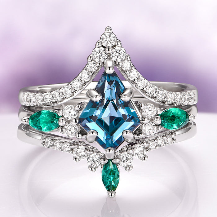 Skye Kite® London Blue Topaz & Emerald Deer Couples Ring Set by Aquamarise features a kite-shaped London Blue Topaz center stone with marquise emeralds and sparkling diamonds on a sterling silver band, part of Matching Couples' Rings and May and November Birthstone Jewelry collections.